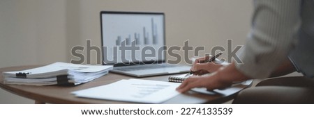 Image of woman calculate tax invoice at home, summarizing taxes, money planing.
