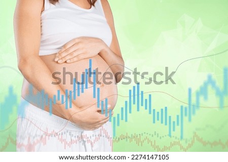 Happy pregnant woman with chart of hormone level Royalty-Free Stock Photo #2274147105