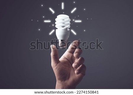 Ideas for designing new things, Creative design thinking, Using new technology to innovate in the future, hand holding light bulb. Bright and creativity for work concept.