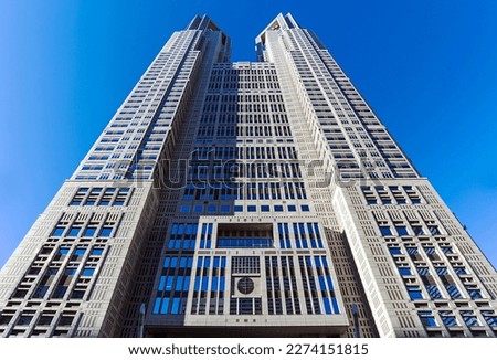 Tokyo Metropolitan Government Building with blue sky during warm sunny day Royalty-Free Stock Photo #2274151815