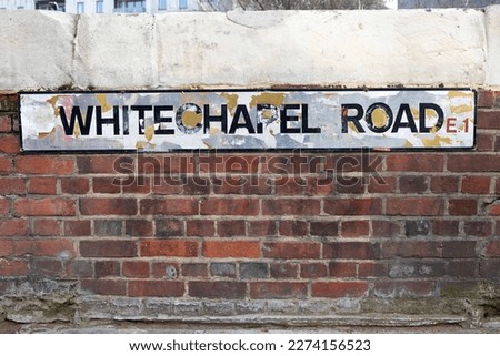 Close-up of a street sign for Whitechapel Road, in London, UK.