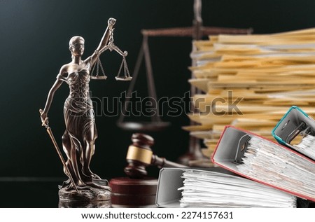 Wooden hammer, files on the judge table Royalty-Free Stock Photo #2274157631