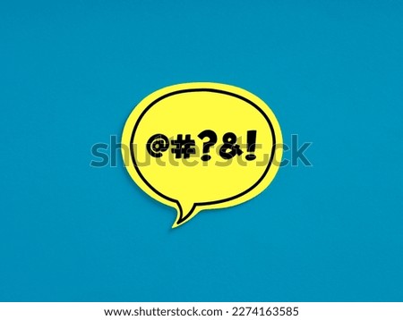Swear words or cursing on yellow speech bubble on blue background. Getting mad, upset or angry over a troll comment or forum post. Fight and disagreement online. Royalty-Free Stock Photo #2274163585