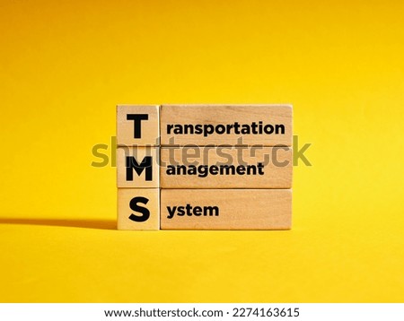 Wooden cubes with the the acronym TRM transportation management system. Planning and coordination of logistic delivery business.