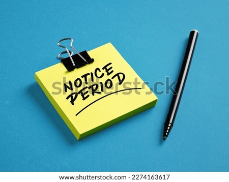 The word notice period on yellow sticky note paper with a black pen on blue background. Business job resignation announcement concept. Royalty-Free Stock Photo #2274163617