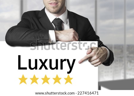 businessman pointing on sign luxury golden rating stars
