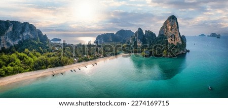 Panoramic aerial view of the beautiful Railay beach, Krabi, Thailand, lush rain forest and emerald sea during morning sunrise without people Royalty-Free Stock Photo #2274169715