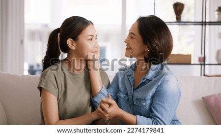 Middle aged asia people old mom love care trust comfort help young teen talk crying stress relief at home. Mum as friend listen adult child woman feel pain sad worry of broken heart life crisis issues Royalty-Free Stock Photo #2274179841