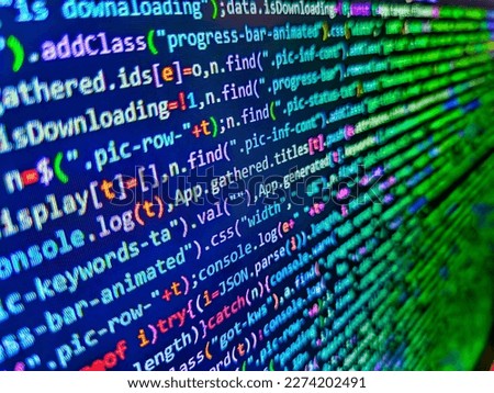 HTML code on the screen editor,. Programming code abstract. Black background with blue text like old CRT monitors. Web programming and bracket technology background