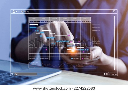 Male manager managing business planning project schedule in the office. Gantt chart showing on virtual screen. business people manage computer data in digital technology on the internet