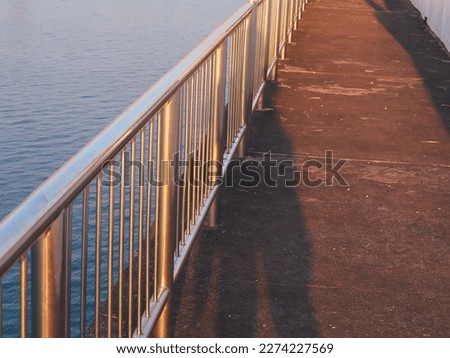 handrail on the bridge over the river