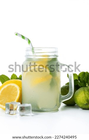 Lemonade drink in a jar glass and ingredients  isolated on white background