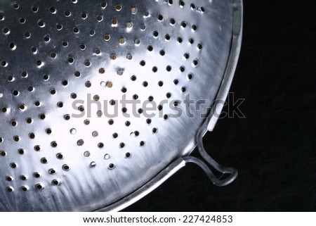Thai traditional style of stainless steel sieve use as a ThaiÃ¢Â?Â?s cuisine kitchenware represent the cooking material.
