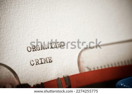 Organized crime text written with a typewriter. Royalty-Free Stock Photo #2274255775