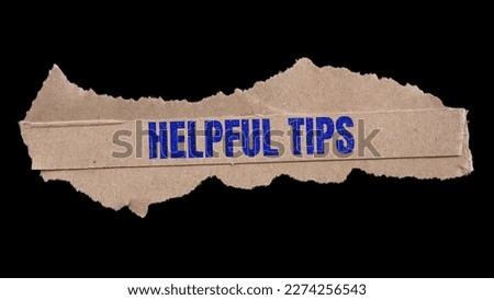 Helpful Tips message on paper. Tips and Tricks concept background.