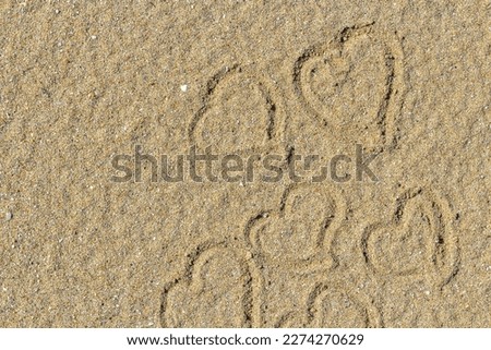Heart drawn in the sand. Beach background. Top view. declaration of love through a picture