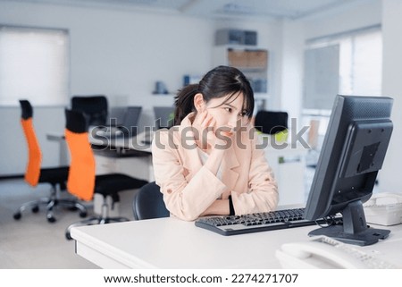 Tired businesswoman working overtime until morning Royalty-Free Stock Photo #2274271707
