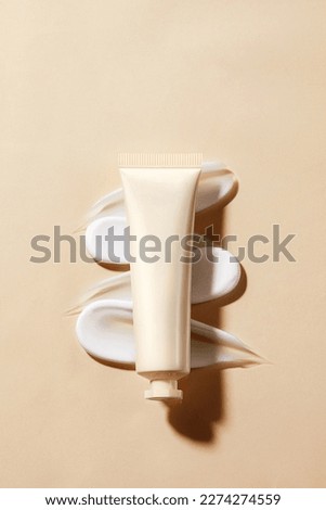 Skin care products, hand cream, facial cleanser, pink cream Royalty-Free Stock Photo #2274274559