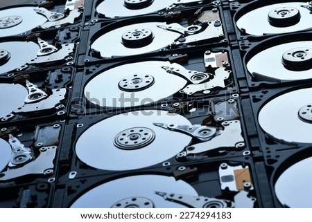 Group of hard disk drives. Many Open Hard drives. Close-up of the inside of PC hard drives. Technology background. Selective focus