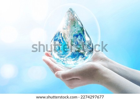 world water day concept, hands in the shape of a water drop of the globe. Elements of this image furnished by NASA.
