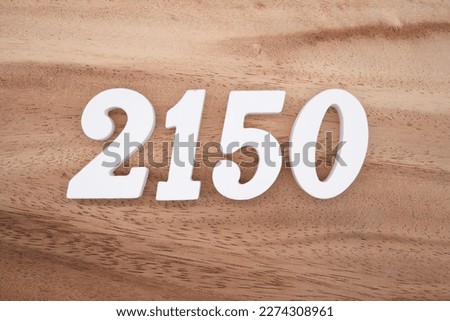 White number 2150 on a brown and light brown wooden background.