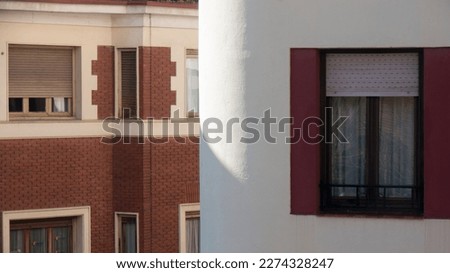 Building round corner and brick facade