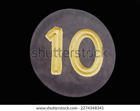 Golden number 10 isolated, black background photo format
