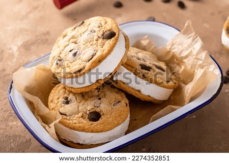 Ice cream sandwiches with vanilla ice cream and chocolate chip cookies, homemade sweet treat