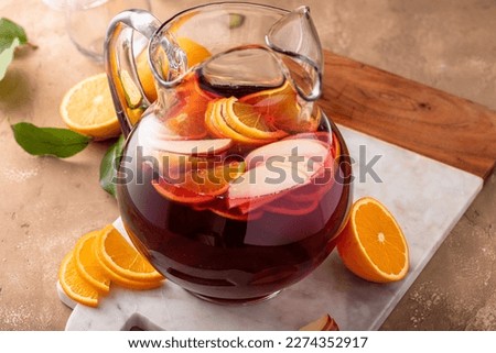 Refreshing summer berry sangria with apples, oranges and blueberry in a pitcher Royalty-Free Stock Photo #2274352917