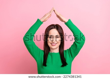 Portrait of positive nice lady beaming smile arms make show roof gesture above head isolated on pink color background