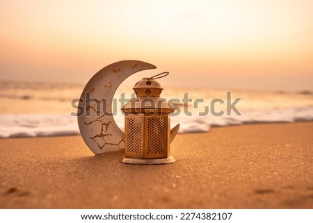 Traditional Candle light with Crescent moon shape on the beach, Ramadan Kareem background 2024