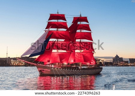 Saint-Petersburg. Holiday of Scarlet Sails. Russia. A sailboat sails on the Neva. Annual alumni celebration. Miracle night show on the Neva River in St. Petersburg, romantic ship with scarlet sails Royalty-Free Stock Photo #2274396263