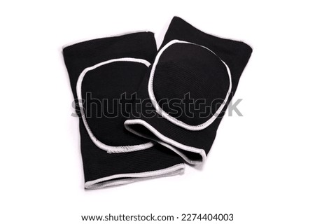 Sports protective knee pads for volleyball or gymnastics isolated on a white Royalty-Free Stock Photo #2274404003