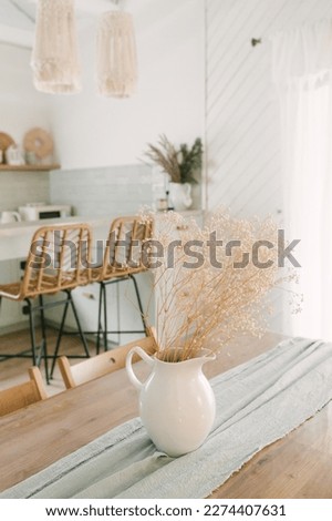 modern wooden house. Rich Scandinavian-style interior with wooden table and vintage kitchen