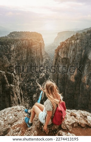 Woman tourist outdoor hiking Tazi canyon in Turkiye travel solo healthy lifestyle eco tourism in mountains girl hiker with backpack on cliff active summer vacations  Royalty-Free Stock Photo #2274413195