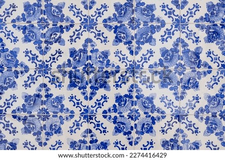 Beautiful blue tiles known as azulejos, covering many buildings in Porto, Portugal, valued for their intricate designs and vibrant colors and also for durability to water and harsh weather conditions