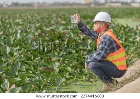 Environmental engineers inspect water quality,Bring water to the lab for testing,Check the mineral content in water and soil,Consultation to solve the problem of chemical contaminated water sources Royalty-Free Stock Photo #2274416683