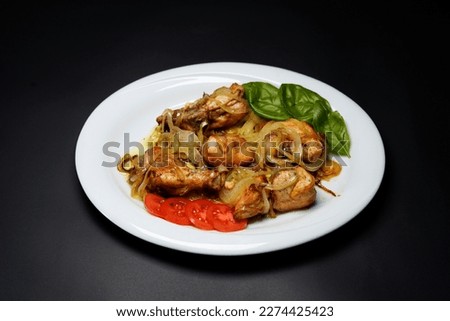 Chicken Do Pyaza isolated black background Indian food