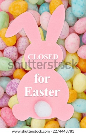 Closed for Easter sign on a bunny with Easter eggs  Royalty-Free Stock Photo #2274443781