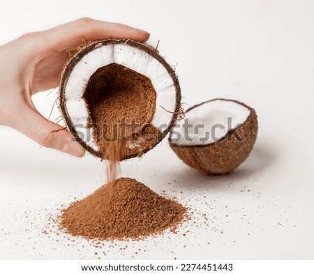 Coconut sugar pouring from coco nut fruit. Royalty-Free Stock Photo #2274451443