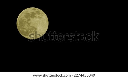 A picture of a full Moon on the black Sky