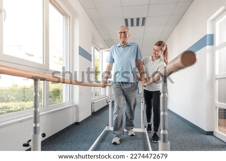 Senior Patient and physical therapist in rehabilitation walking exercises Royalty-Free Stock Photo #2274472679