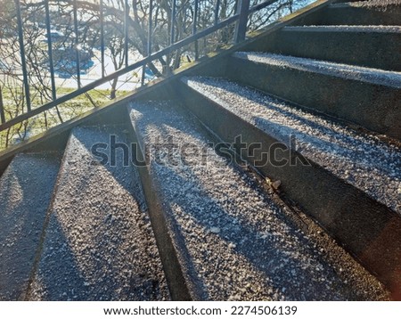 Salted concrete stairs winter in Denmark - prevention of ice formation. Royalty-Free Stock Photo #2274506139