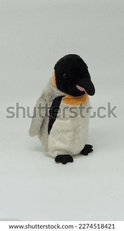 Penguin doll isolated on white background.