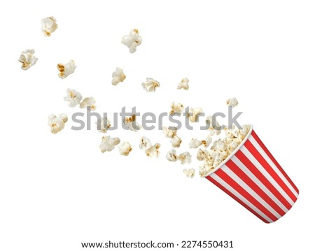 Popcorn flakes flying to bucket, realistic popcorn box isolated on white vector background. Popcorn splash from red white striped bucket for cinema snack or movie theater fast food menu Royalty-Free Stock Photo #2274550431