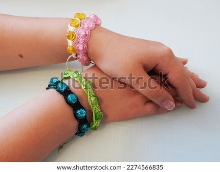 Female hands with hippie bracelets. Female hands with beautiful bracelets