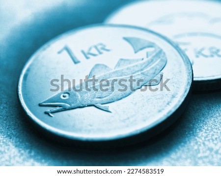 Icelandic 1 one crona coin close-up. National currency of Iceland. Light blue tinted money illustration for news about economy or finance. Bank and loan. Savings and interest. Crone of Iceland. Macro Royalty-Free Stock Photo #2274583519