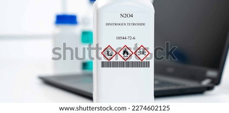 N2O4 dinitrogen tetroxide nitrogen(IV) oxide CAS 10544-72-6 chemical substance in white plastic laboratory packaging Royalty-Free Stock Photo #2274602125
