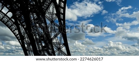 Eiffel Tower against the background of a beautiful sky with clouds. Paris, France