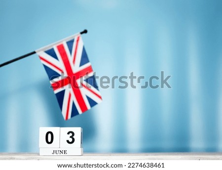 June Calendar With British Flag With Number  3. Calendar cubes with numbers. Space copy.